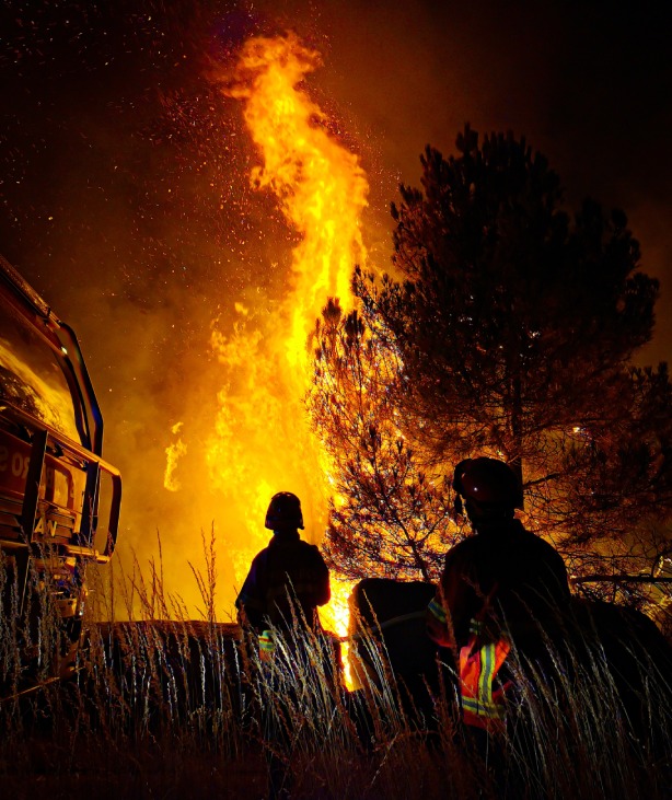 Two Persons are watching Fire